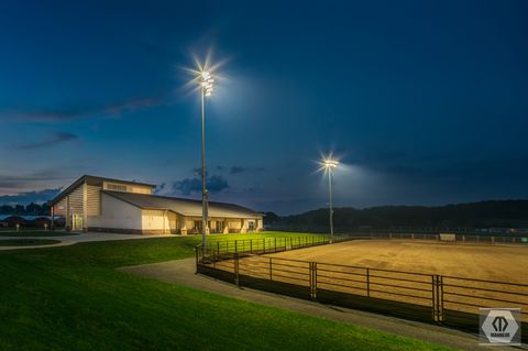 another night view of equestrian education center and outdoor arena; photo credit Manheim