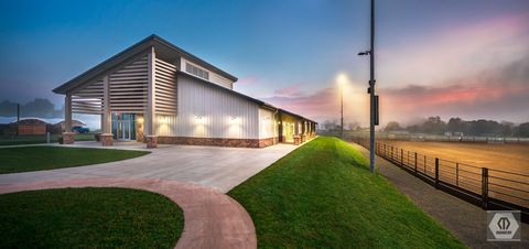 4th night view of equestrian education center and outdoor arena; photo credit Manheim