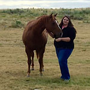 Cassandra in the field with horses